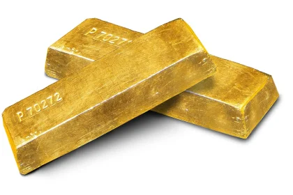 Gold ingots arranged on a plain background, photographed as a store of value.