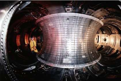 The glowing interior of a tokamak fusion reactor during an experiment
