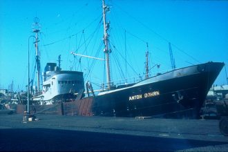 A research vessel at sea under open skies