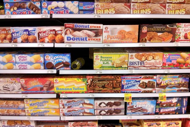 Supermarket shelves with packaged foods and nutrition labels