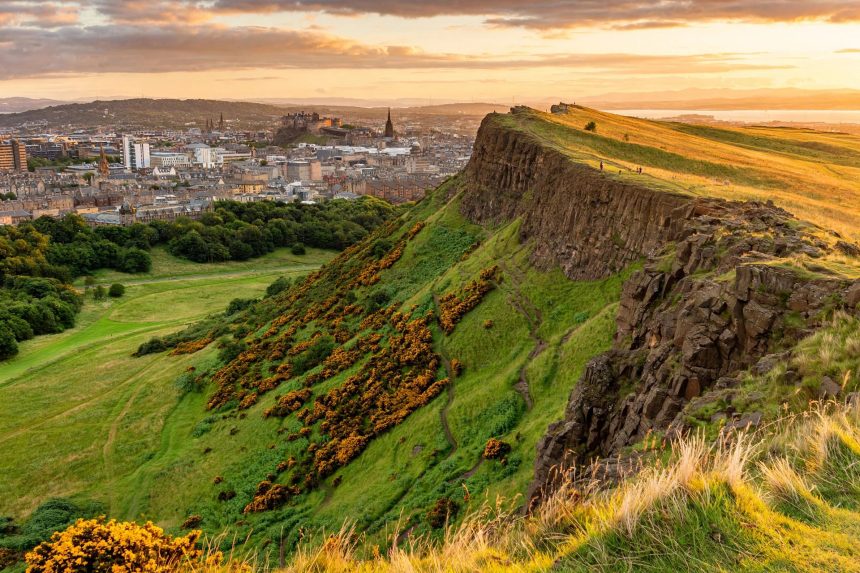 Arthur's Seat rises above Edinburgh in golden light, the destination Florence Pugh calls her eighth wonder of the world.